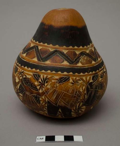 Gourd vessel with carving of musicians