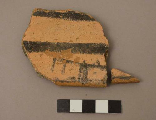 Rim sherd of bowl, exterior red slip, interior black-on-buff. gila polychrome