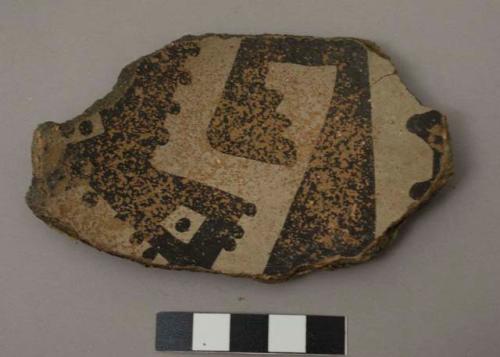 Rim sherd of a bowl; interior has black and white geometric design, exterior surface slipped red - gila polychrome.