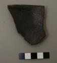 Rim sherd from a bowl. black on white linear design on interior, red slipped exterior - gila polychrome