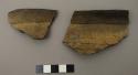 Rim sherd of a large bowl?. Corrugated ware.