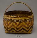 Twill-plaited handled carrying basket with square base