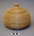 Coiled pine needle basket with knobbed lid