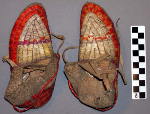 One pair of children's moccasins--decorated on top and bottom with beadwork