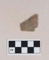 Chipped stone, projectile point fragment, asymmetrical, one side corner-notched