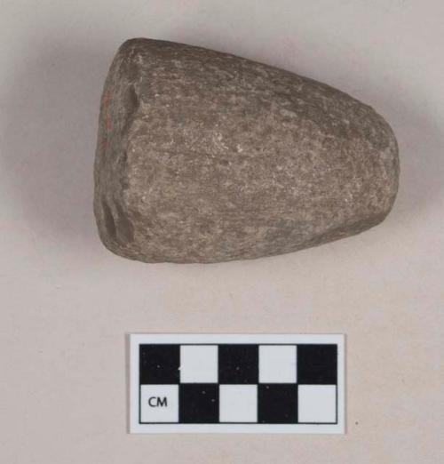 Ground stone, conical object, pecked and ground, likely preform pipe