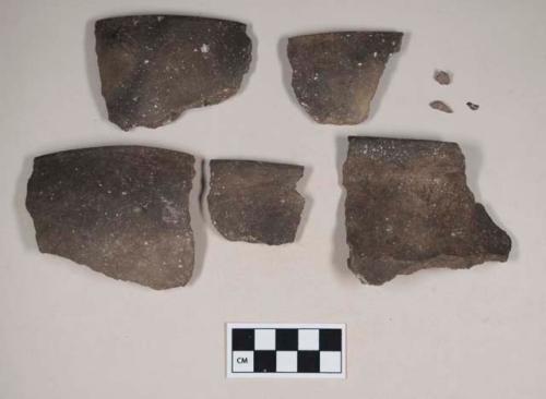 Ceramic, earthenware rim sherds, undecorated, one with flared rim, shell-tempered; two sherds crossmend