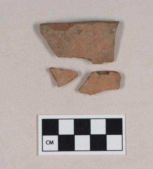 Ceramic, red-bodied earthenware rim and body sherds, possible incised decoration near rim; three sherds crossmend