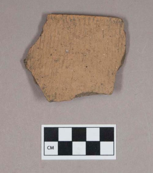 Ceramic, earthenware rim sherd, cord-impressed, grit-tempered