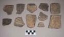 Ceramic, earthenware body and rim sherds, incised, many with possible Ramey design, one undecorated, two cord-impressed, one cord-impressed and incised, one with punctate rim, one with one whole and one partial perforation, shell-tempered