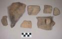 Ceramic, earthenware rim, body, and handle sherds, cord-impressed, one cord-impressed and incised, shell-tempered