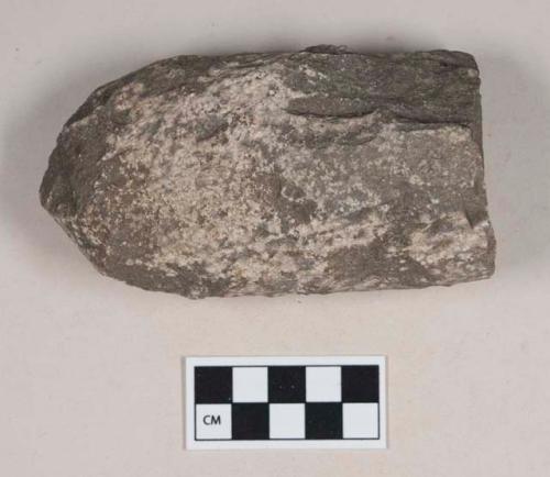 Chipped and pecked stone fragment, semi-cylindrical