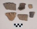 Ceramic, earthenware rim sherds, shell-tempered, one dentate, two with incised rims, one incised, one incised and with molded rim, one with double lugs on rim