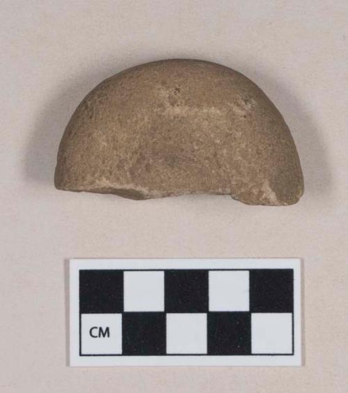 Ground stone, discoidal stone fragment, pounding stone, pitted on both sides