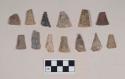 Chipped stone, projectile points, triangular, many fragmented, two with possible reworked tips, one with possible notch; chipped stone, biface fragment