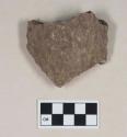 Ground stone, soapstone vessel fragment, textured exterior