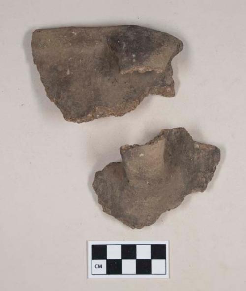 Ceramic, earthenware rim, body, and handle sherds, undecorated, shell and grit tempered; two sherds crossmend