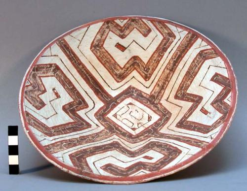 Dish, red, white, and brown quadrilateral motifs. 9.25" x 2" h.