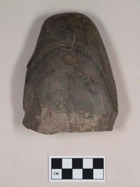 Ground stone, edged tool fragment, pecked and ground