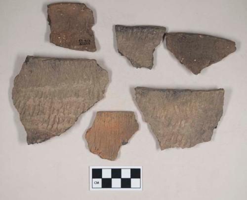 Ceramic, earthenware rim sherds, cord-impressed, grit-tempered; two sherds crossmend