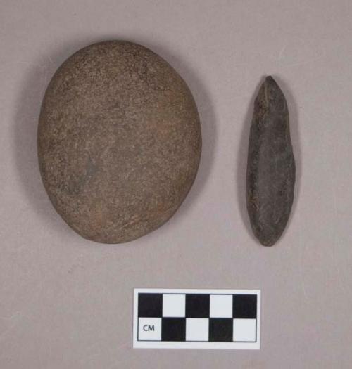 Ground stone, one ovoid, flat on one side; one discoidal; possibly natural