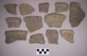 Ceramic, earthenware rim and body sherds, incised, some incised and cord-impressed, some incised and punctate, one undecorated, shell-tempered
