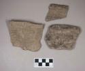 Ceramic, earthenware rim sherds, one incised, one cord-impressed and incised with possible Ramey design, one with incised rim, shell-tempered