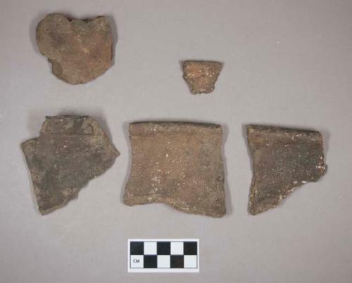 Ceramic, earthenware rim and body sherds, four undecorated, one with punctate rim, shell-tempered; three rim sherds crossmend