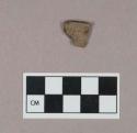 Ceramic, earthenware rim sherd, cord-impressed, grit-tempered