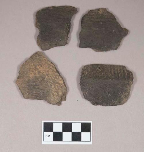 Ceramic, earthenware body sherds, cord-impressed, grit-tempered; two sherds crossmend