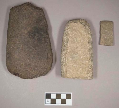 Ground stone, pecked and ground stone fragments; ground stone, flat edged tool fragment, with fossil of shell