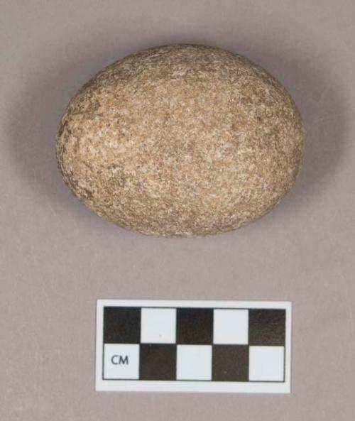 Ground stone, ovoid stone, pecked at one end, possible pounding stone