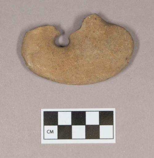 Ground stone, perforated stone fragment, possibly natural