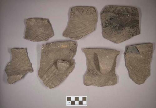 Ceramic, earthenware rim and handle sherds, incised with possible Ramey design, some incised and cord-impressed, one with incised rim, one with incised and punctate rim, shell-tempered