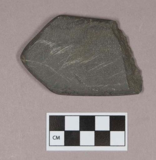 Ground stone, flat stone fragment, pointed at one end