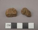 Raw material?, worked?, two specimens, brown in color