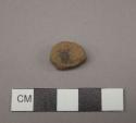 Raw material, stone?, oval and flat in shape, brown in color