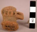 Ceramic sherd, molded bird head, body missing