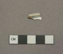 White undecorated pearlware vessel base fragment, portion of foot ring, white paste
