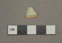 Green on white decorated pearlware vessel rim fragment, white paste, likely green shell-edged
