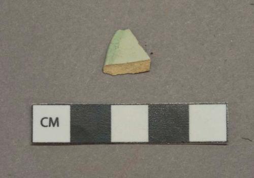Green on white decorated pearlware vessel rim fragment, white paste, likely green shell-edged