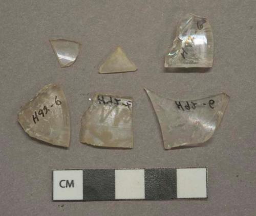 Colorless glass fragments, 1 with etched decoration, 2 stemware base fragments