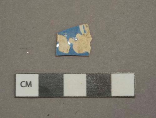 Blue decorated lead glazed earthenware vessel body fragment, white paste, likely machine turned slip decorated