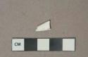 Opaque white plastic fragment
