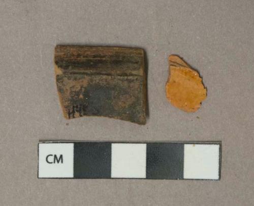 Brown lead glazed redware vessel rim and body fragments