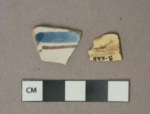 Blue and brown on white handpainted tin-glazed earthenware vessel body fragments, buff paste