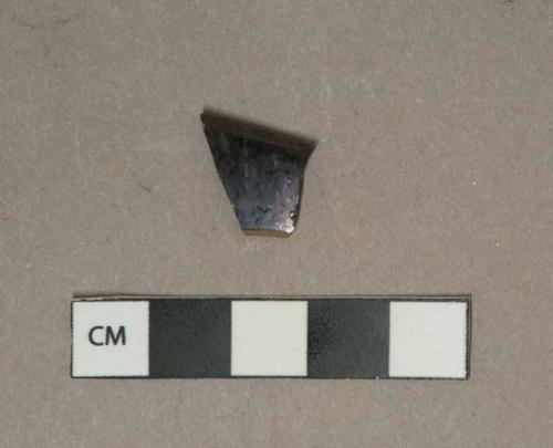 Black lead glazed earthenware vessel rim fragment, grey paste, likely jackfield type