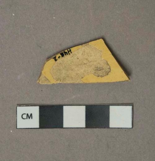 Yellow lead glazed earthenware vessel body fragment, buff paste, possible mocha type