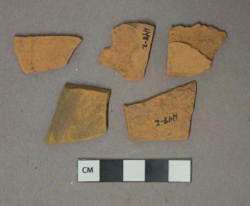 Unglazed undecorated redware vessel body fragments, possibly terracotta