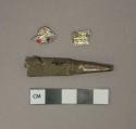 Metal alloy fragments, 2 likely from cigar wrapper, 1 possible nozzle or pen tip